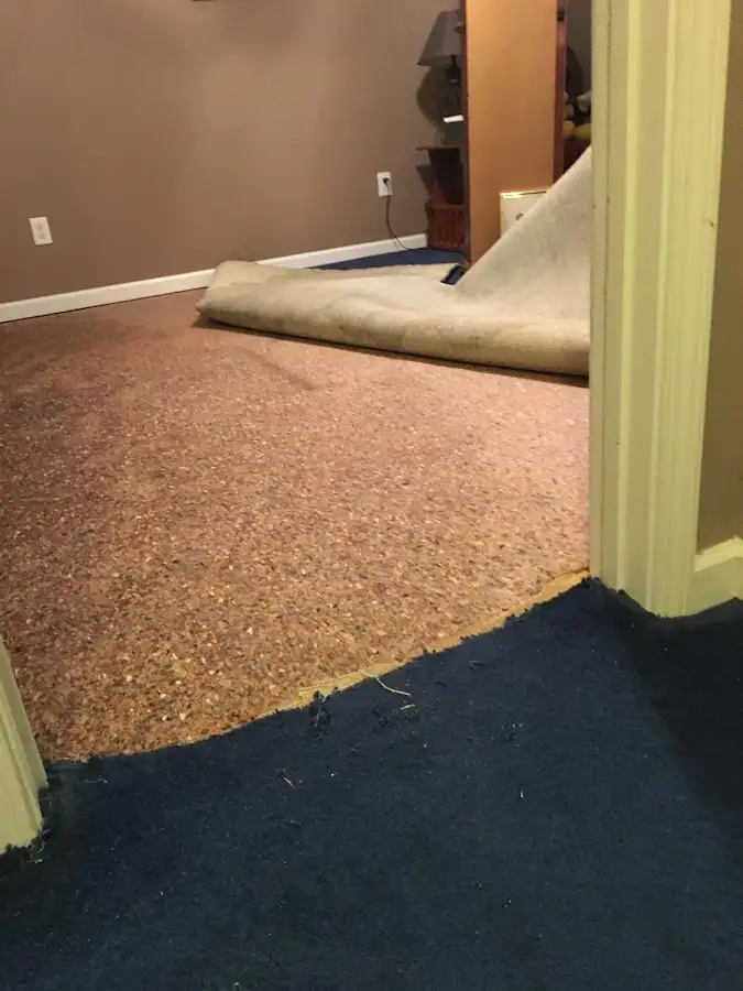 Carpet pad removal revealing water damage during Water Mitigation Services in Cascade